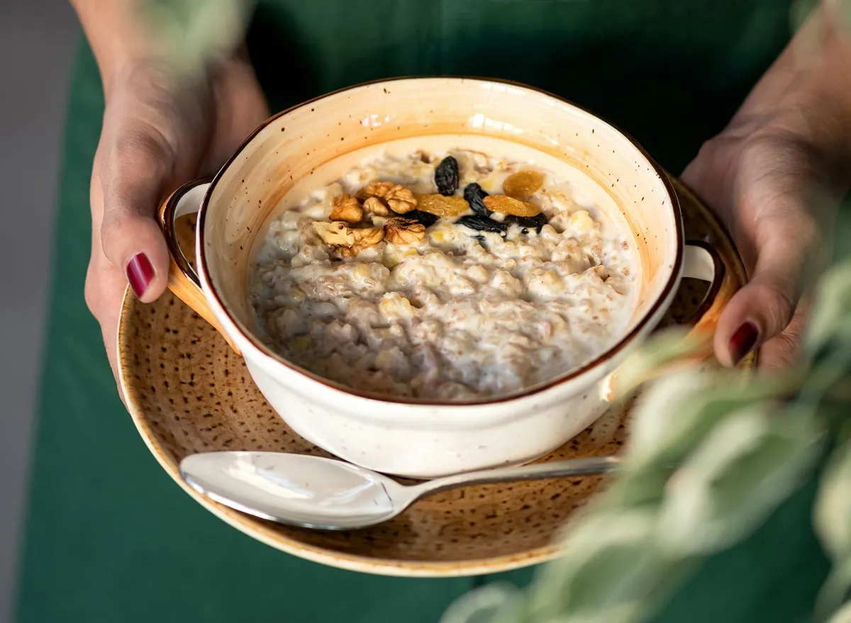 woman holding bowl of oatmeal