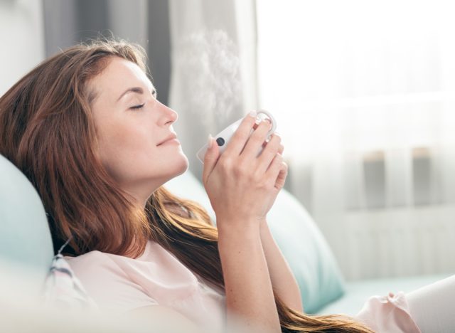 woman on couch with coffee