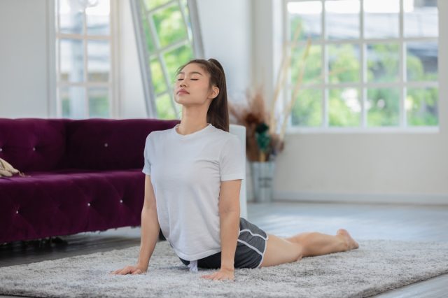 young woman in cobra pose