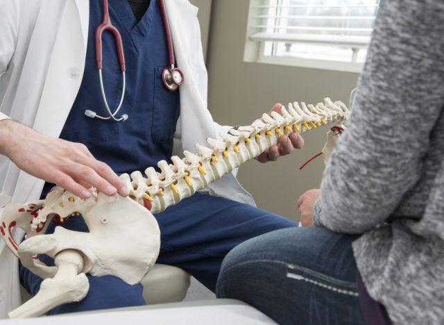 doctor showing patient bones