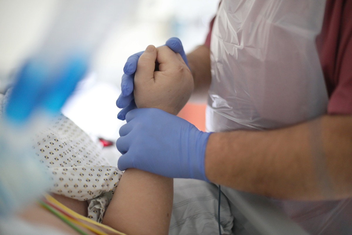 A patient receives physiotherapeutic care in the intensive care and monitoring area at hospital.