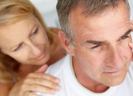 Woman comforting anxious husband