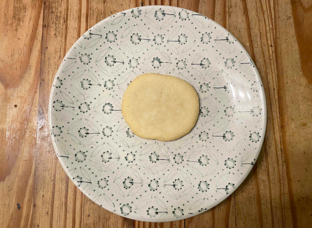 a sugar cookie on a printed plate. 