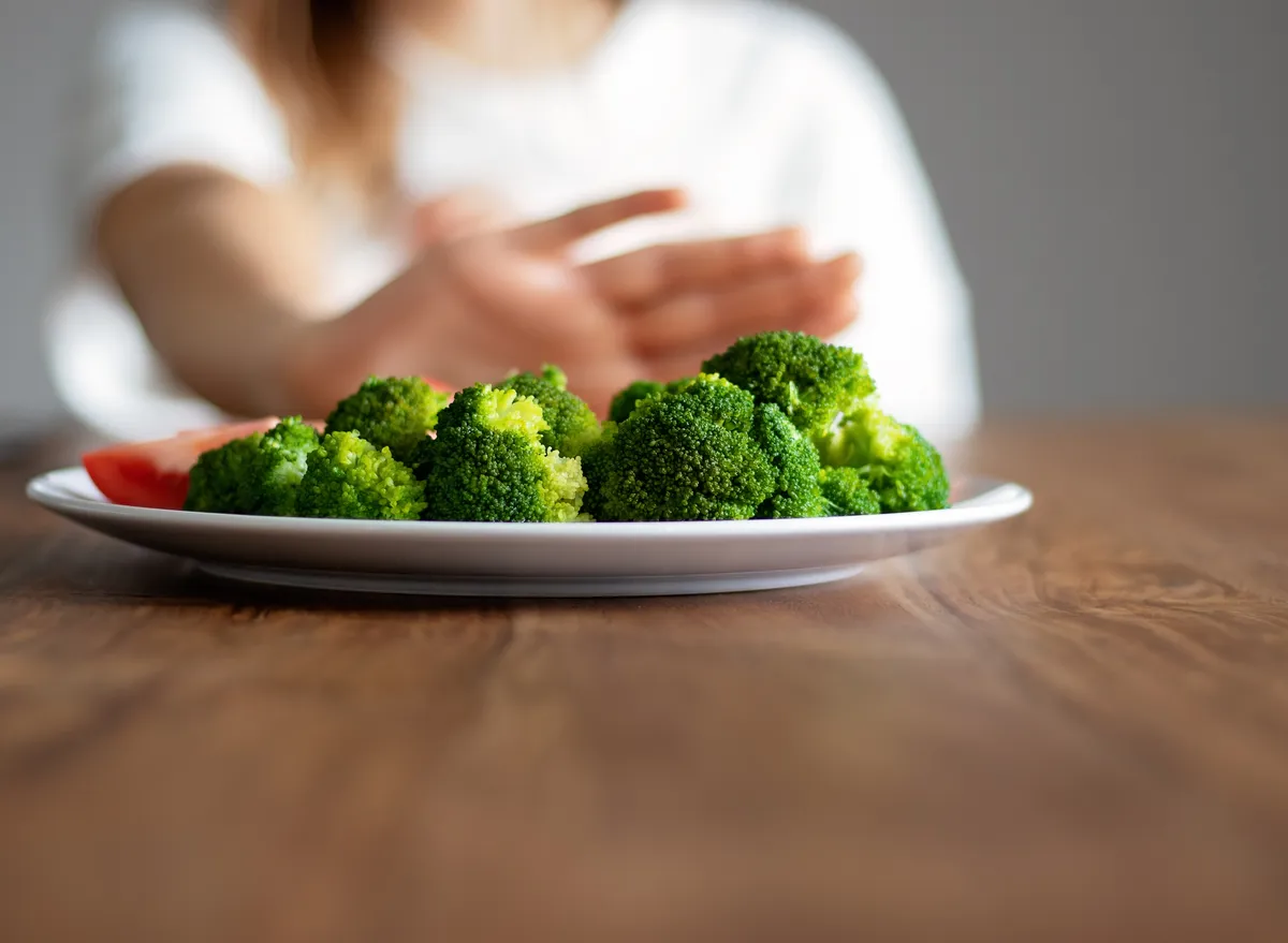 Pushing Away Plate Of Broccoli