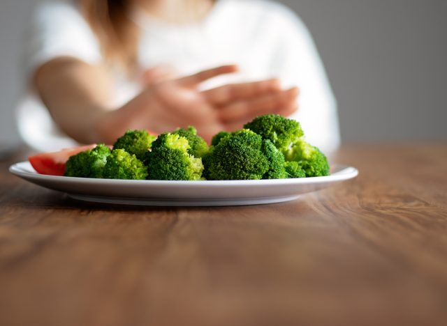 pushing broccoli plate away