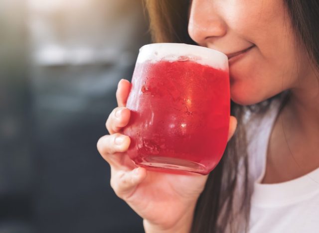 woman drinking sugary beverage