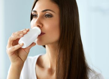 woman drinking yogurt drink