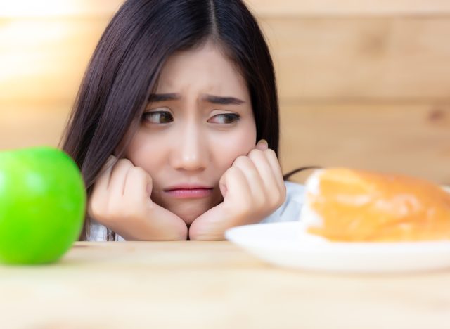 worried woman looking at bread