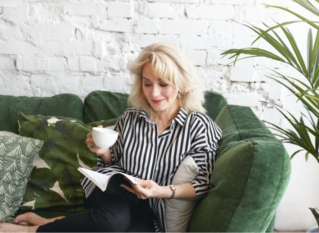 senior woman reading and drinking tea