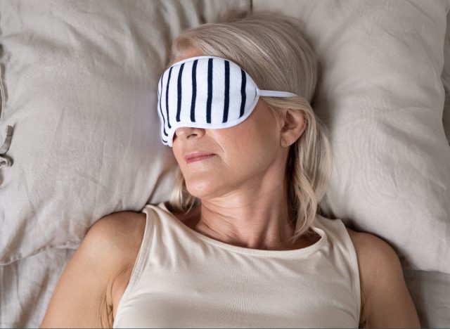 the woman sleeps with a sleeping mask