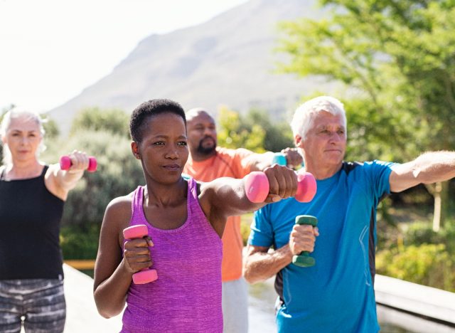 group exercise outdoors with free weights