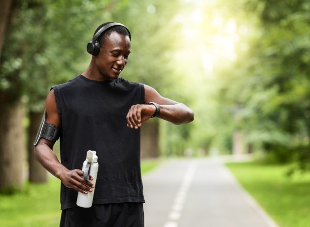 man checking fitness watch