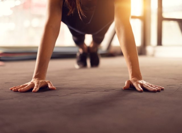 woman attempting to do a pushup