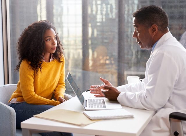 doctor and patient having a somber conversation