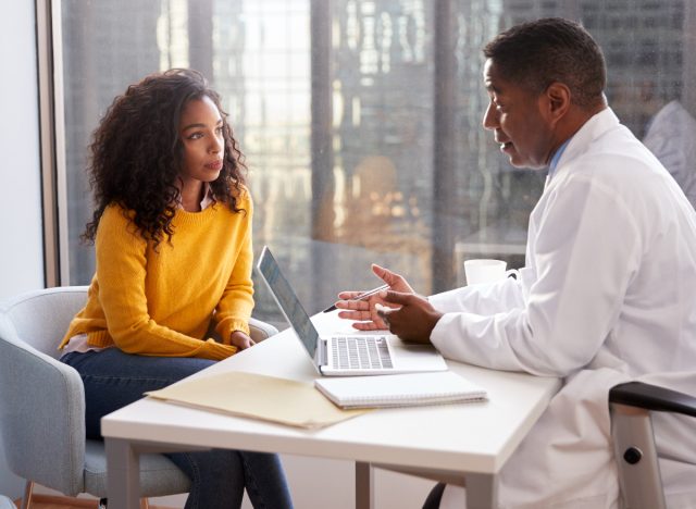 doctor and patient having a somber conversation