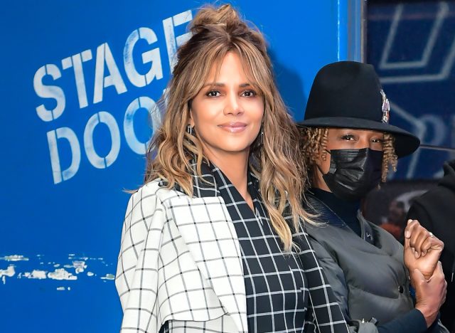 Halle Berry poses in black and white checkered pantsuit