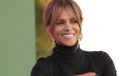 halle berry wearing a black turtleneck and laughing