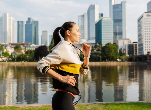 woman jogging in the city by water