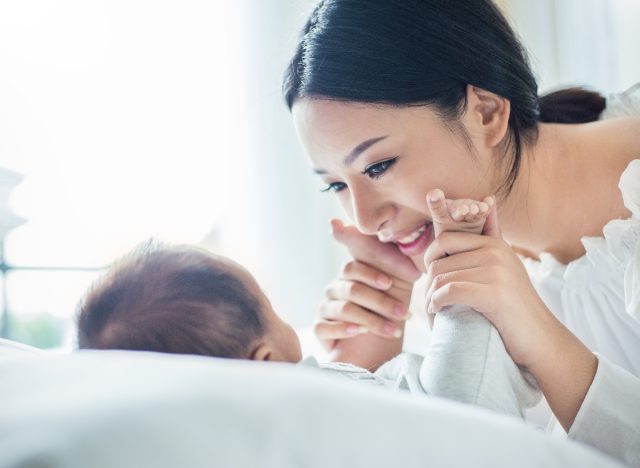 new mom smiling with her newborn