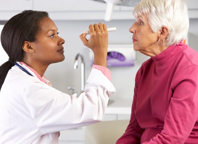 older woman gets an eye exam