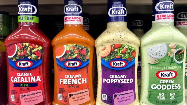 bottles of salad dressing on grocery shelves