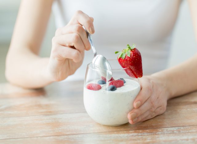 eating yogurt with berries