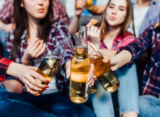 friends cheering with beers