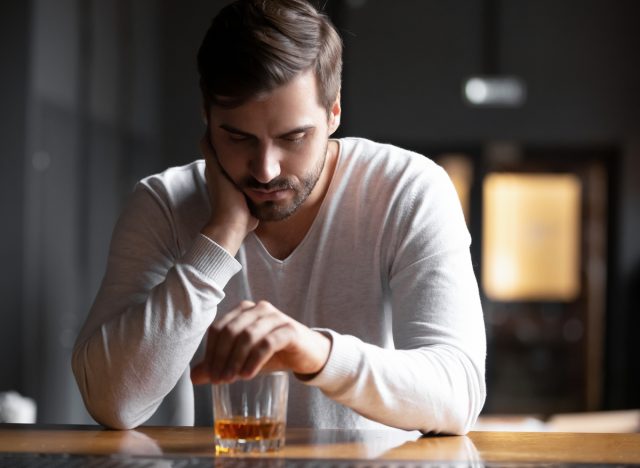 man drinking alone