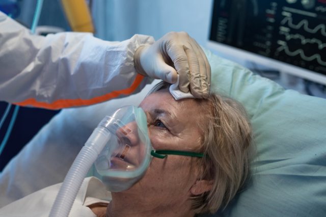 Close-up of covid-19 infected patient in bed in hospital