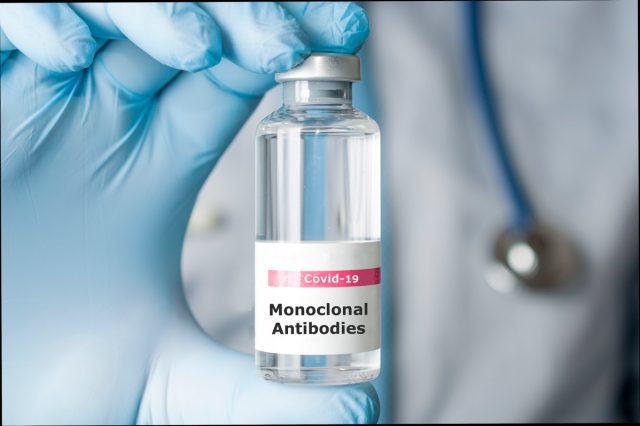 The doctor is holding a vial of monoclonal antibodies, a new drug for coronavirus Covid-19