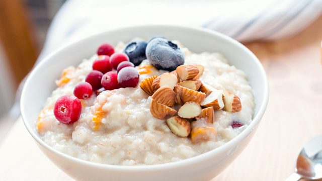 bowl of oatmeal with berries and nuts