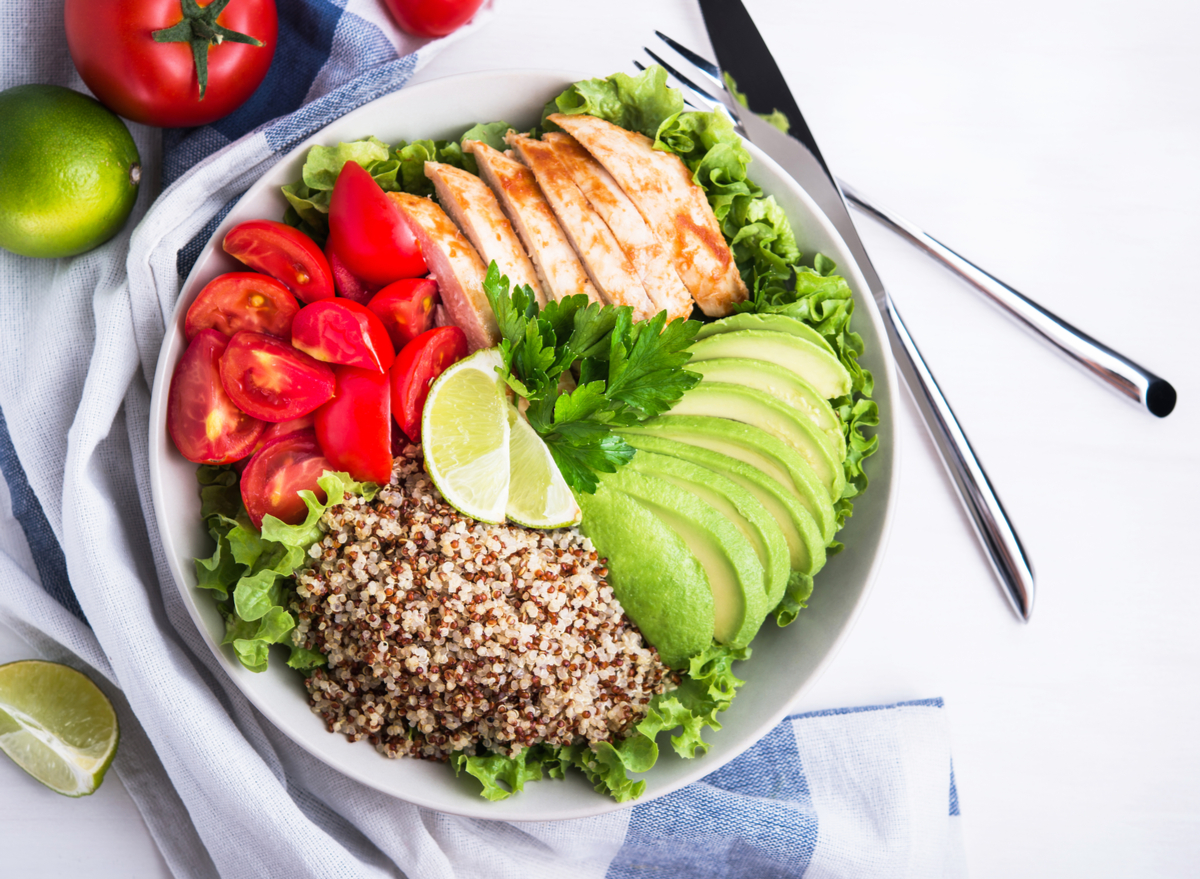 quinoa over salad with chicken and avocado