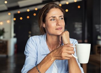 woman holding coffee mug