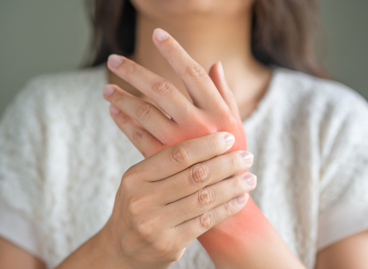 woman holding wrist