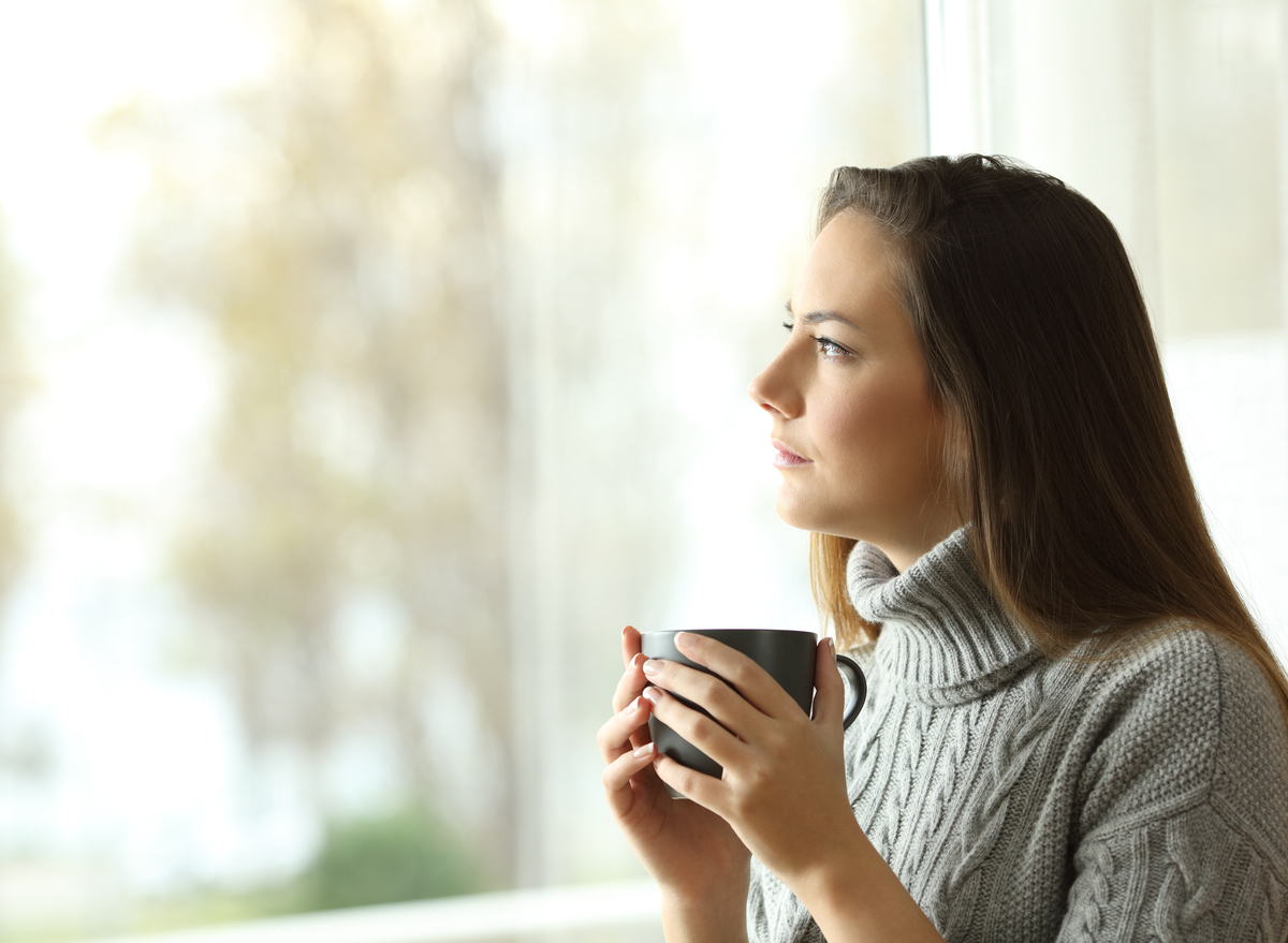 woman thinking and looking out the window
