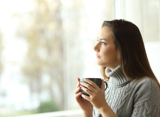 woman thinking and looking out the window