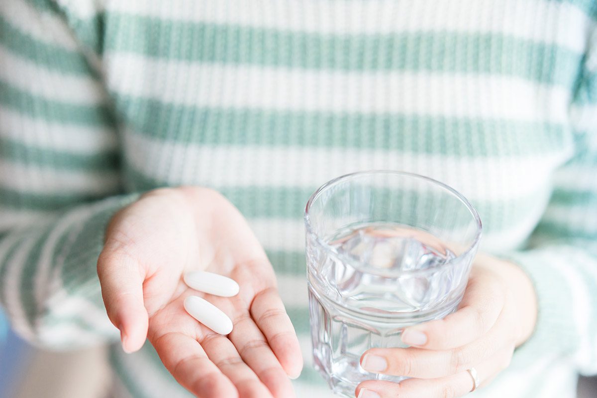 woman taking supplements