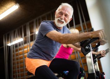 man on exercise bike in gym