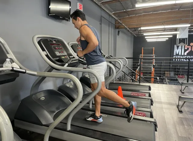 trainer doing treadmill sprints