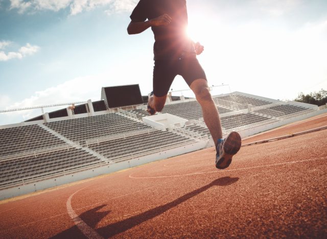 man running on outdoor track