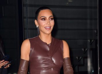 kim kardashian walks outside in brown leather outfit