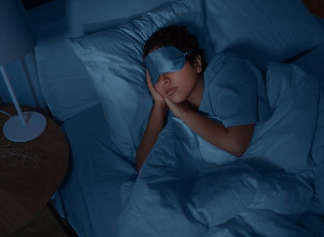 woman sleeping at night with eye mask