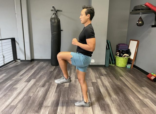 trainer doing high knees