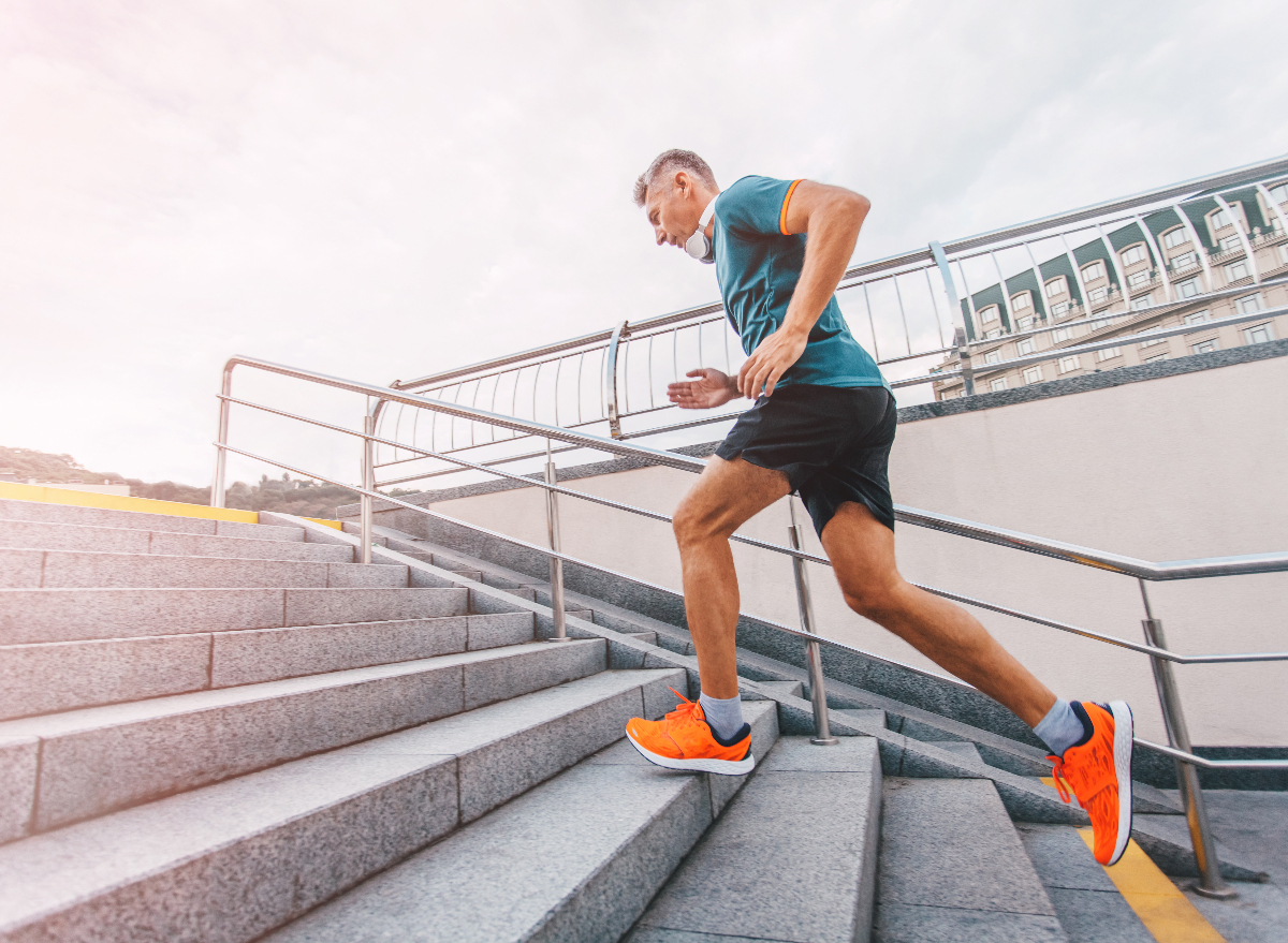 older man running up stairs, outdoor workout