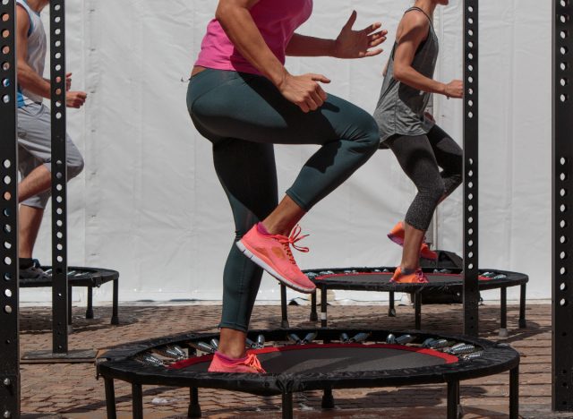 group doing mini-trampoline workout class