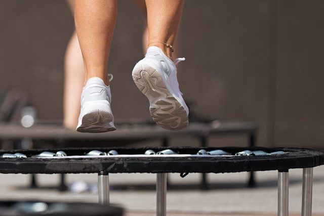 close-up feet on mini trampoline workout