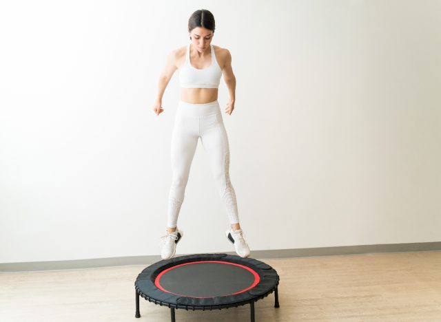 woman doing mini-trampoline jumping workout