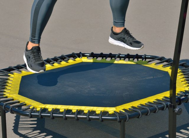 close-up feet jumping on mini-trampoline