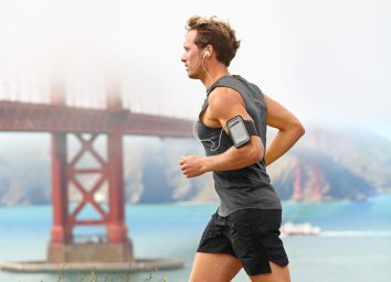 male runner runs on foggy day