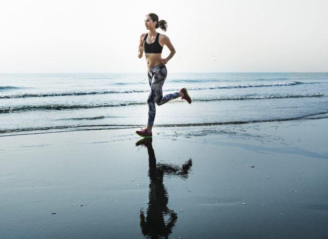 woman completing beach sprints